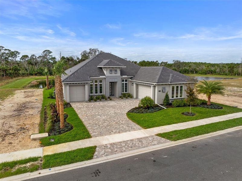 Front exterior of a new home in Veranda Bay, Flagler Beach, FL, highlighting curb appeal (Image 2). Front exterior of a new home in Veranda Bay, Flagler Beach, FL, highlighting curb appeal (Image 2).