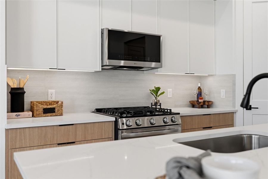 Stylish kitchen with sleek finishes, ample storage, and an oversized island for everyday living.