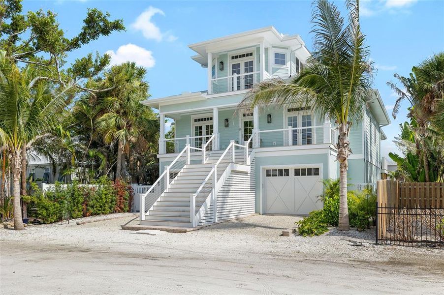 Front exterior of a new home in , Boca Grande, FL, highlighting curb appeal (Image 2). Front exterior of a new home in , Boca Grande, FL, highlighting curb appeal (Image 2).