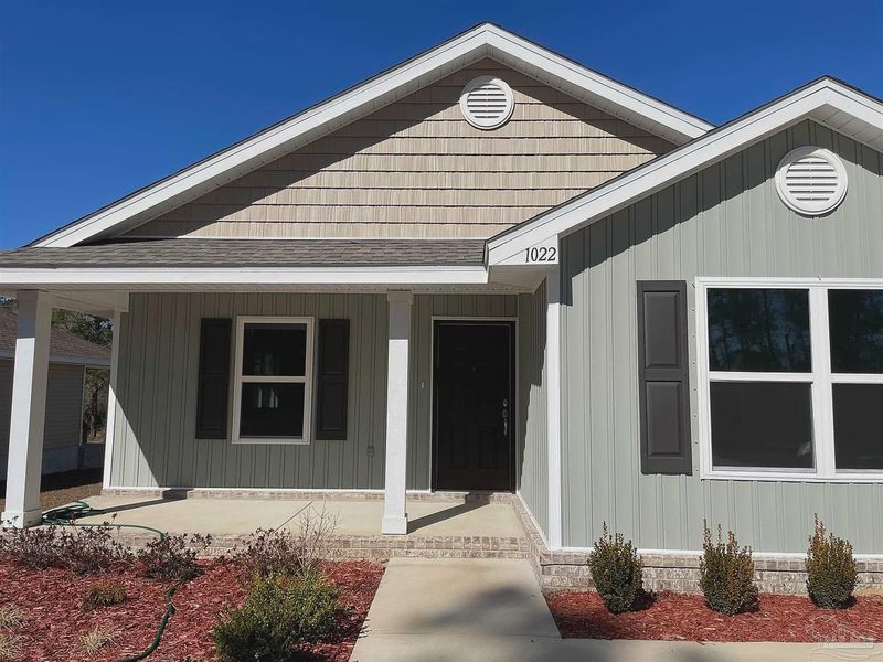 Front exterior of a new home in Turtle Creek, Cantonment, FL, highlighting curb appeal (Image 8).