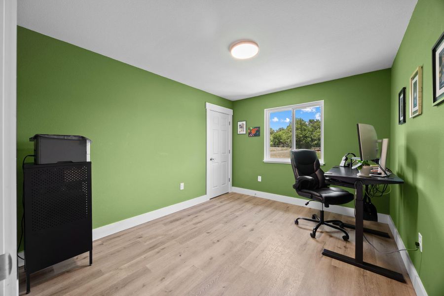 Secondary bedroom that's being used as an office.