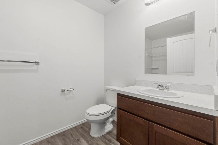 A large full bathroom with quick access from the main living area and kitchen. A large full bathroom with quick access from the main living area and kitchen.