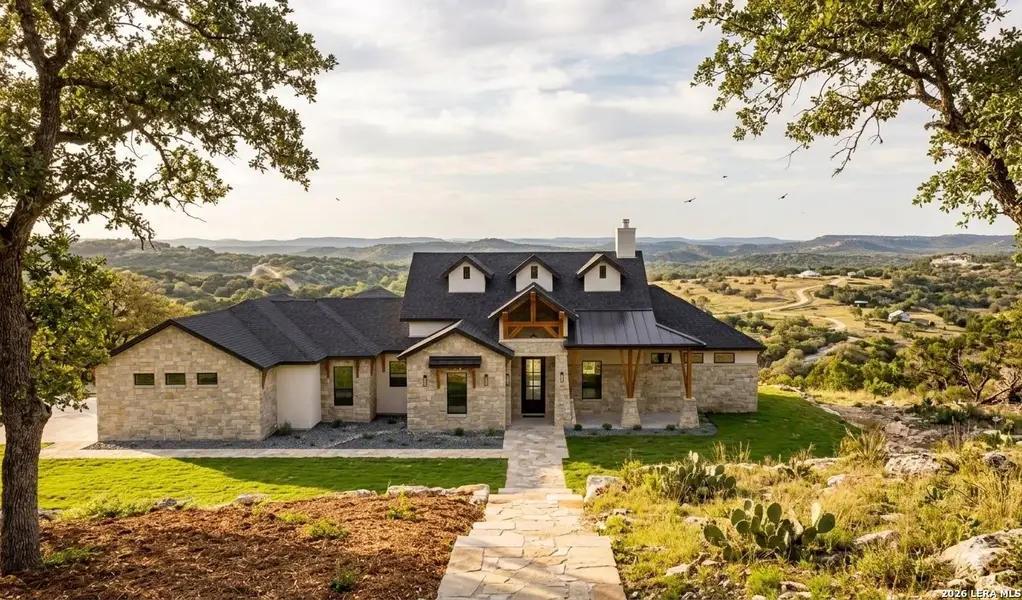 Front exterior of a new home in , Bulverde, TX, highlighting curb appeal (Image 27).