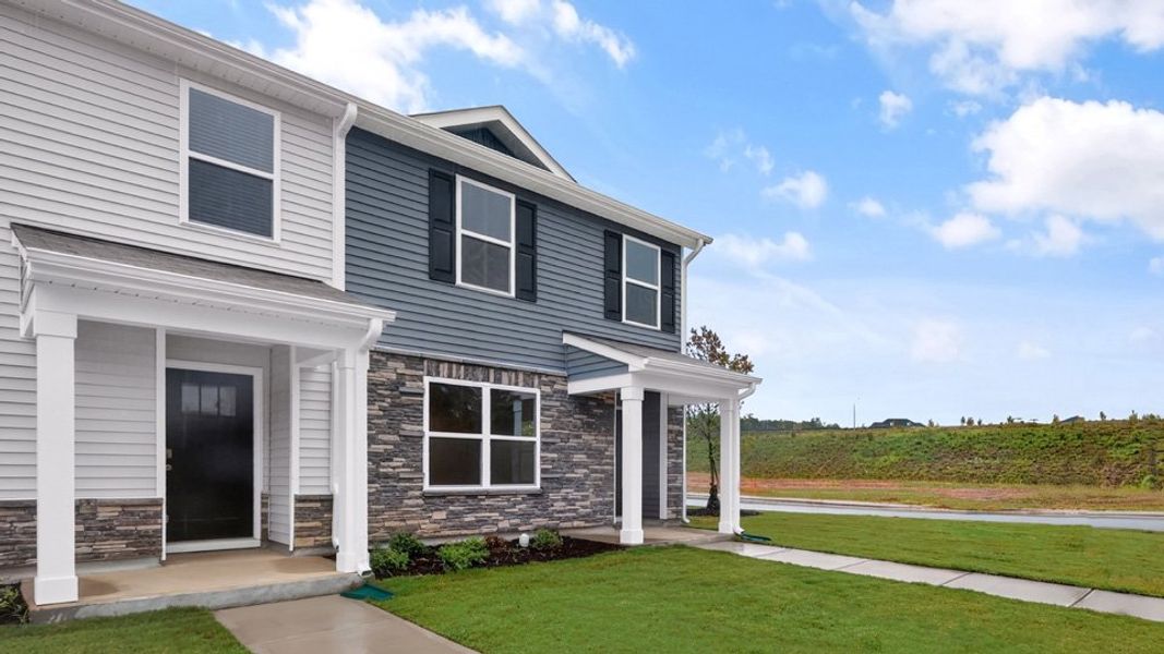Representative exterior photo of a completed home built from the Pearson ll by D.R. Horton in The Townes at Matthews Landing, Fuquay Varina, NC (Image 22).