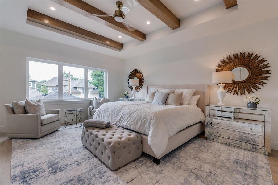 Bedroom featuring baseboards, recessed lighting, beam ceiling, and wood finished floors Bedroom featuring baseboards, recessed lighting, beam ceiling, and wood finished floors
