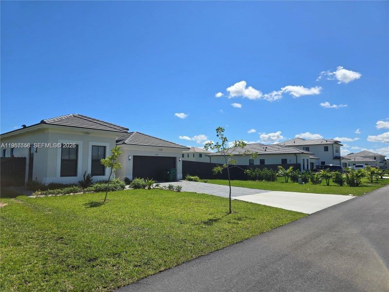 Front exterior of a new home in , Homestead, FL, highlighting curb appeal (Image 31).
