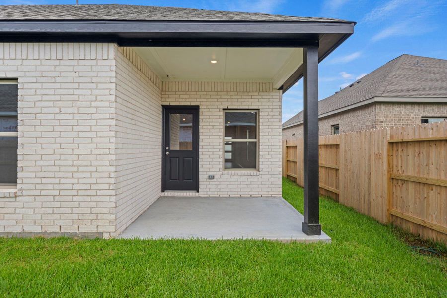 Exterior details and patio area of a home in Windrose Green, Angleton (Image 22).
