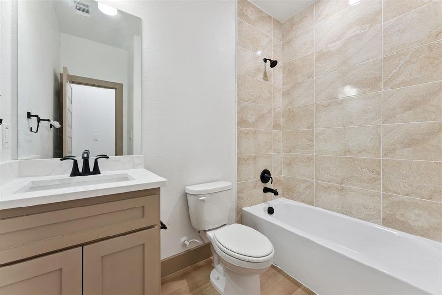 Full bath with tub / shower combination and vanity Full bath with tub / shower combination and vanity