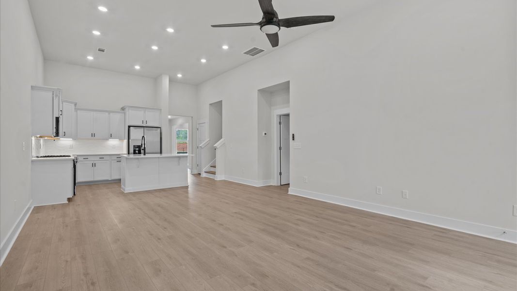 Stunning hardwood flooring in spacious family room with large windows at Aspen Ridge by DRB Homes in Lyman, SC Stunning hardwood flooring in spacious family room with large windows at Aspen Ridge by DRB Homes in Lyman, SC