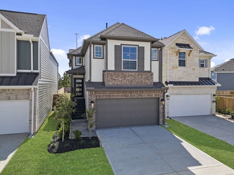 Front exterior of a new home in Bridgeland, Cypress, TX, highlighting curb appeal (Image 20). Front exterior of a new home in Bridgeland, Cypress, TX, highlighting curb appeal (Image 20).