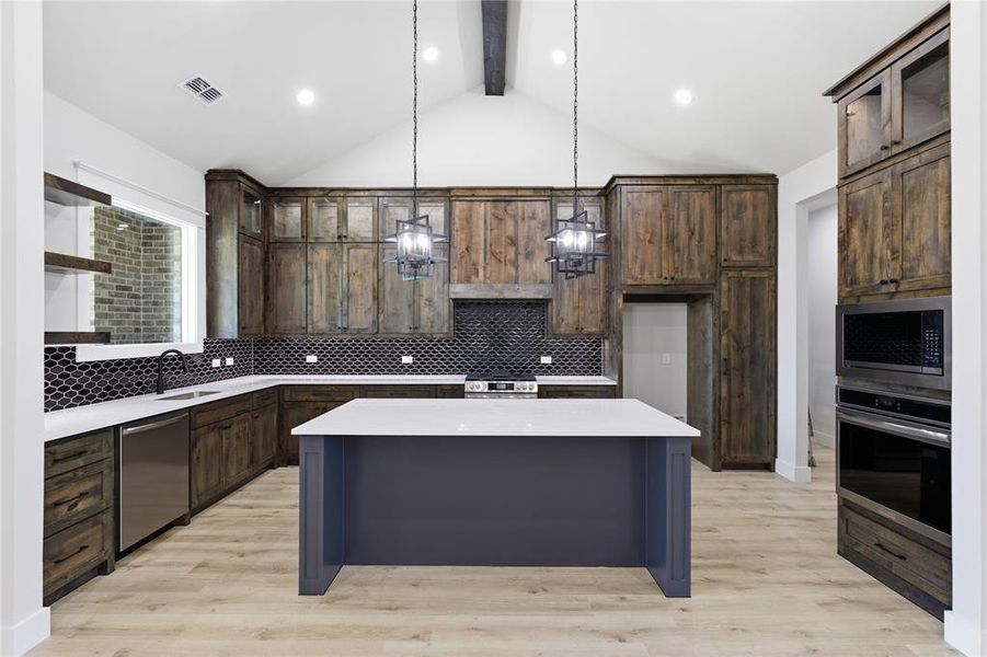 Modern kitchen featuring wood-finish cabinetry and a dark tile backsplash