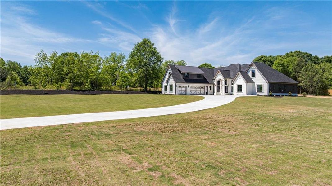 Front exterior of a new home in , Monroe, GA, highlighting curb appeal (Image 42).