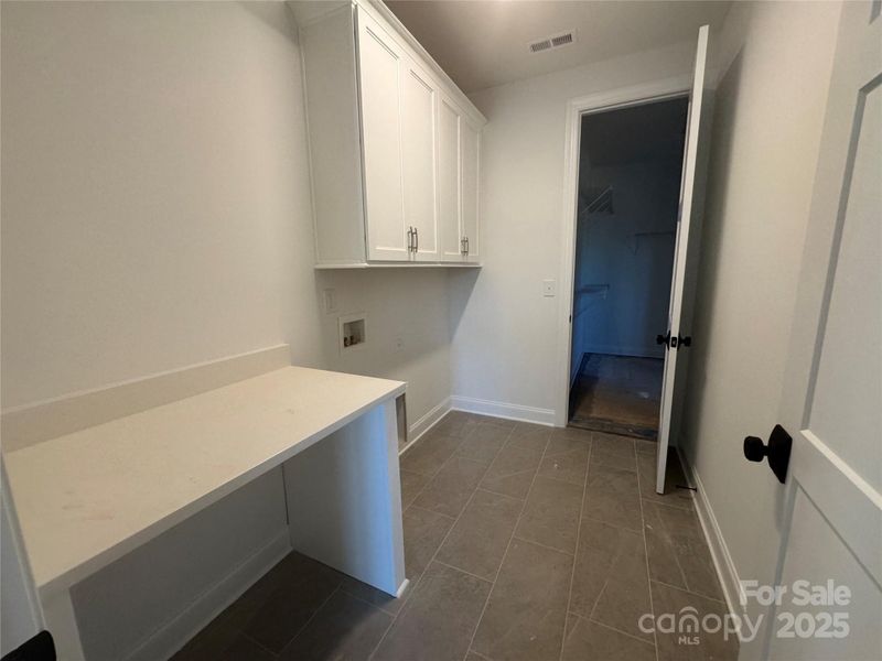 Laundry room with folding table