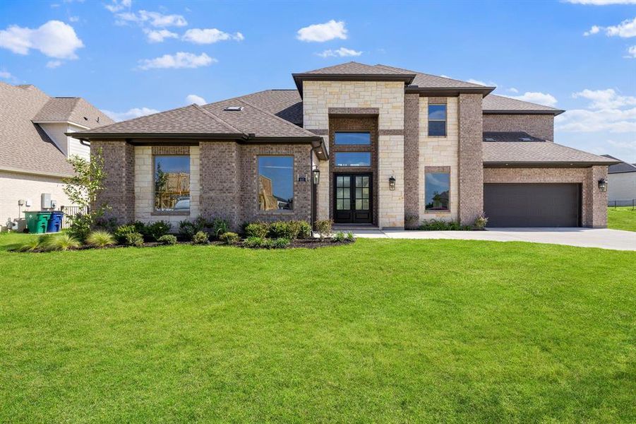 Front exterior of a new home in Heath Golf and Yacht Club, Heath, TX, highlighting curb appeal (Image 1). Front exterior of a new home in Heath Golf and Yacht Club, Heath, TX, highlighting curb appeal (Image 1).