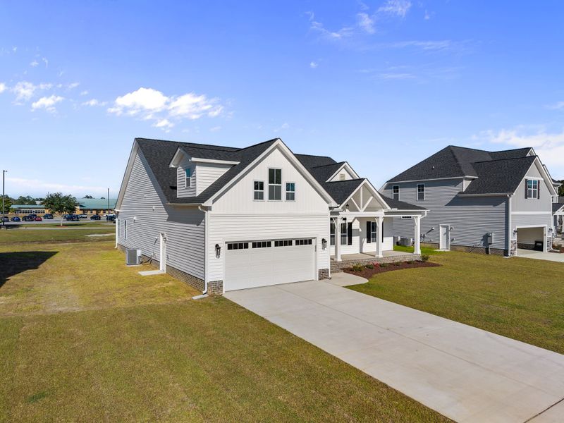 Front exterior of a new home in The Preserve at Langston, Winterville, NC, highlighting curb appeal (Image 27).