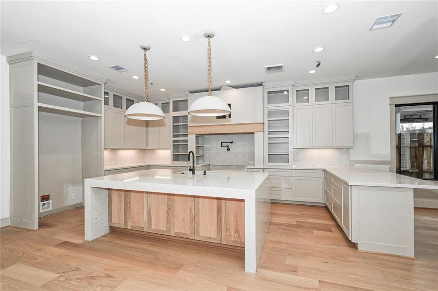 Large Kitchen with connected oversize breakfast room similar to this photo.