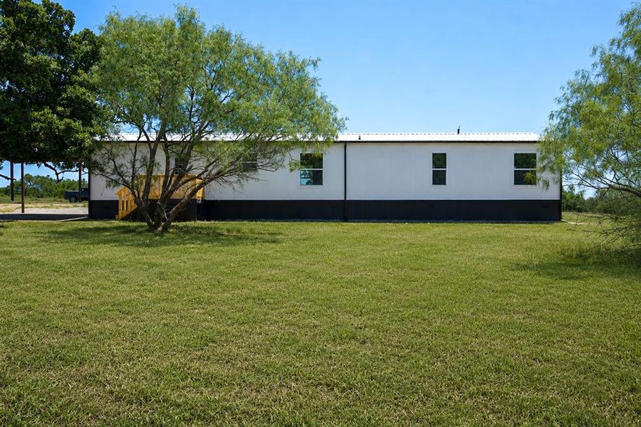 Exterior details and patio area of a home in , Poolville (Image 24).