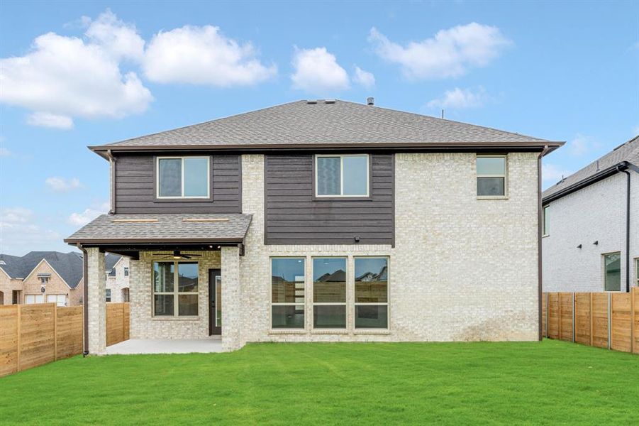 Front exterior of a new home in Painted Tree Woodland District 50, McKinney, TX, highlighting curb appeal (Image 23). Front exterior of a new home in Painted Tree Woodland District 50, McKinney, TX, highlighting curb appeal (Image 23).