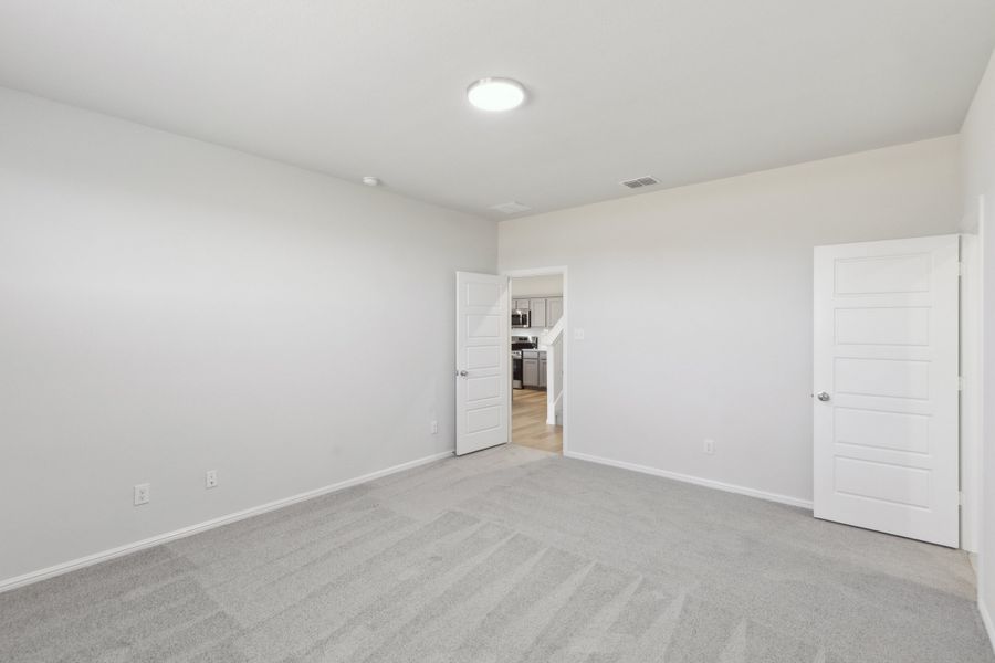 Primary Suite in the Holden home plan by Trophy Signature Homes – REPRESENTATIVE PHOTO Primary Suite in the Holden home plan by Trophy Signature Homes – REPRESENTATIVE PHOTO