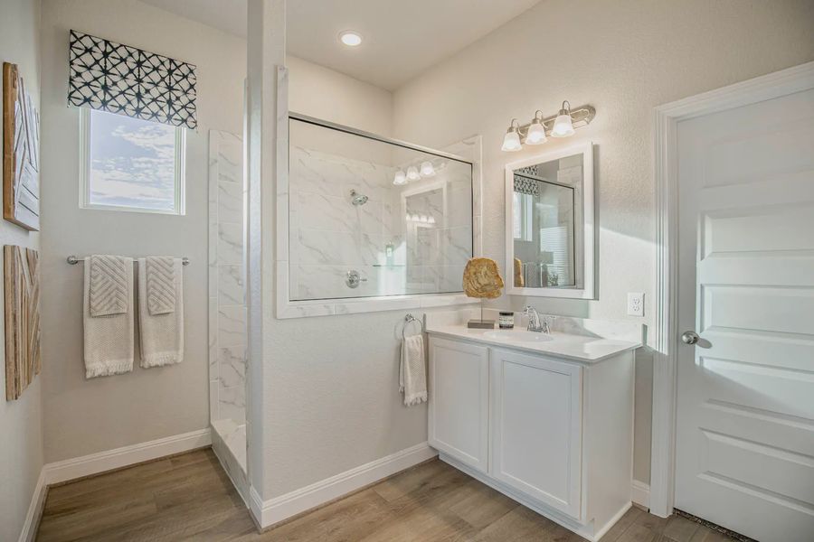 Representative furnished interior of a home built from the Lincoln by Chesmar Homes in Buffalo Crossing, Cibolo (Image 10).