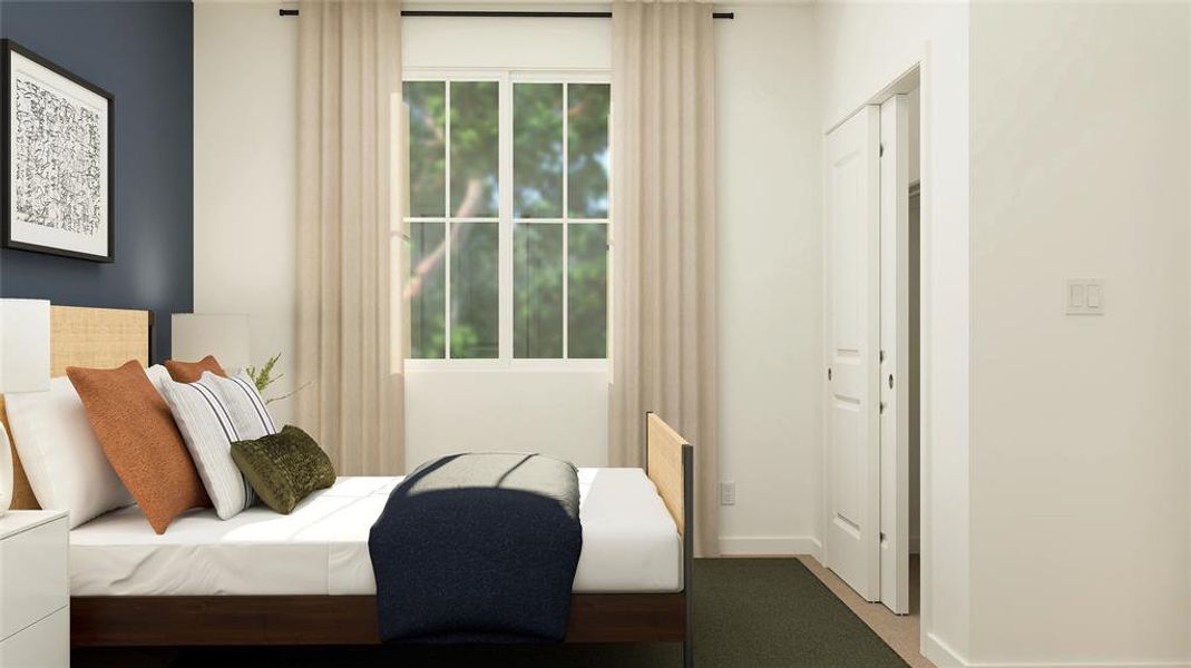 Carpeted bedroom featuring baseboards