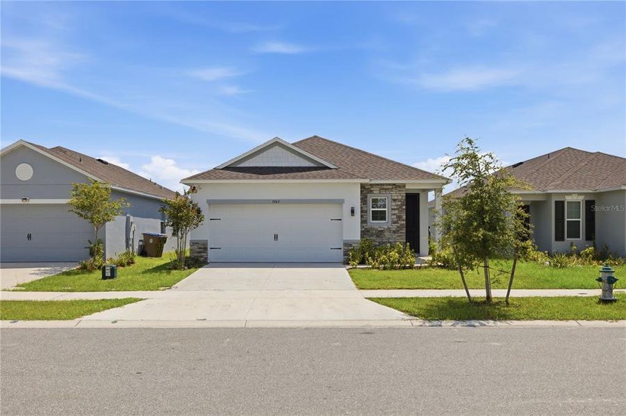 Front exterior of a new home in , Harmony, FL, highlighting curb appeal (Image 24). Front exterior of a new home in , Harmony, FL, highlighting curb appeal (Image 24).