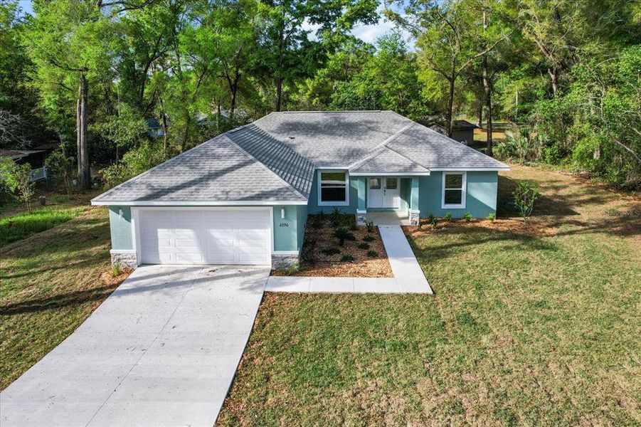 Front exterior of a new home in , Citrus Springs, FL, highlighting curb appeal (Image 1). Front exterior of a new home in , Citrus Springs, FL, highlighting curb appeal (Image 1).