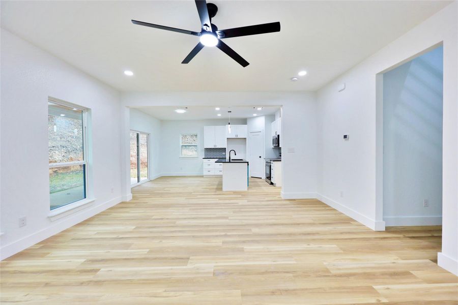 Open layout! Large sliding door in kitchen opens up to covered patio.