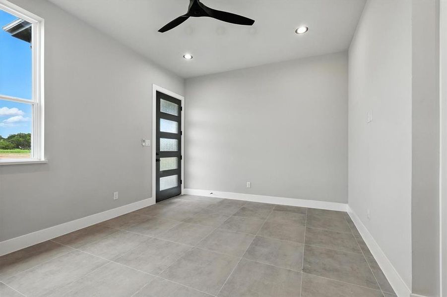 Unfurnished room featuring a ceiling fan, recessed lighting, and tile patterned floors