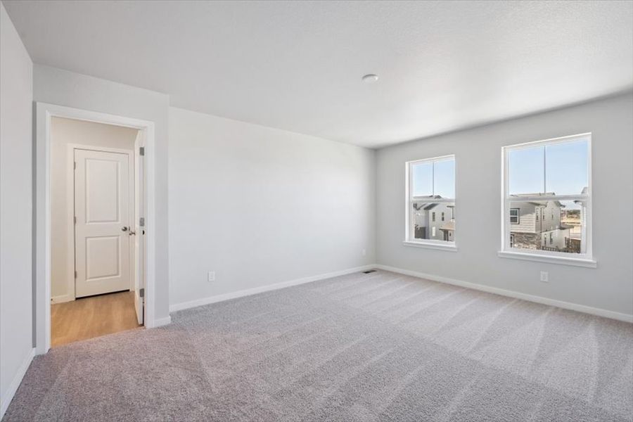 A room with white walls and a door. A room with white walls and a door.