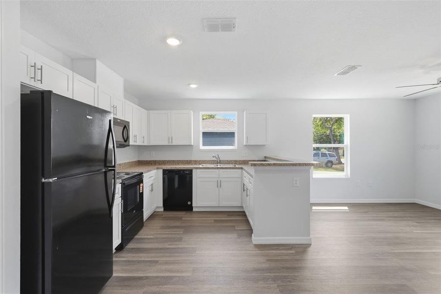 Furnished interior view inside a new home in , Apopka (Image 4).