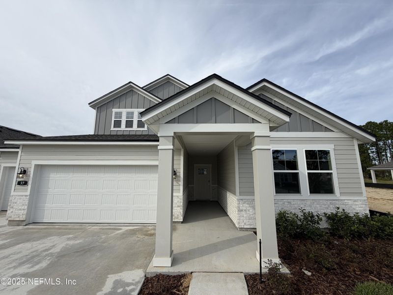 Front exterior of a new home in , Flagler Beach, FL, highlighting curb appeal (Image 26).