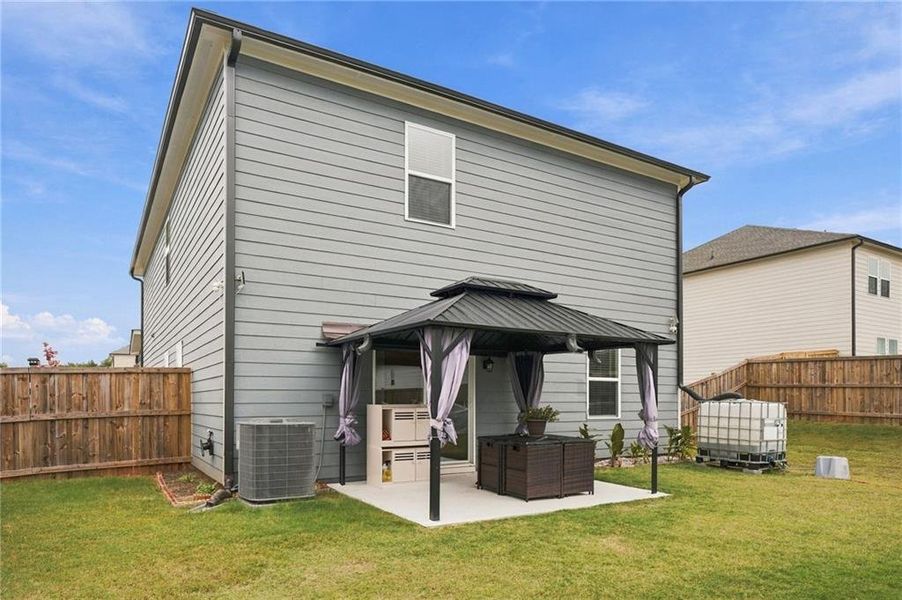 Exterior details and patio area of a home in Heritage Point, Hampton (Image 23).