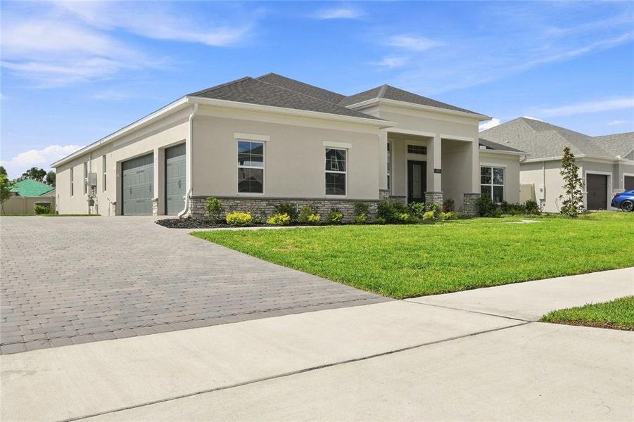 Front exterior of a new home in Willow Run, Apopka, FL, highlighting curb appeal (Image 14).
