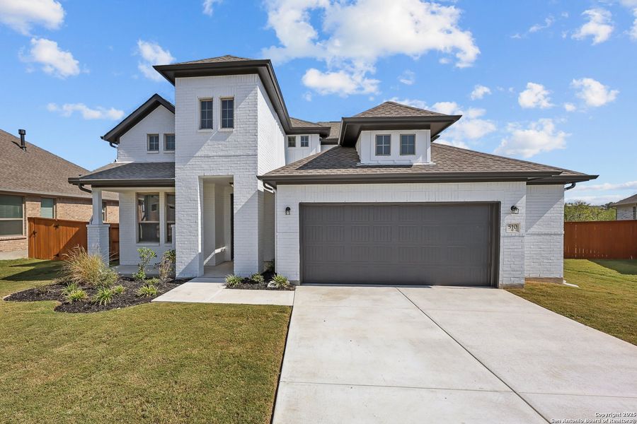 Front exterior of a new home in Foxbrook, Cibolo, TX, highlighting curb appeal (Image 2). Front exterior of a new home in Foxbrook, Cibolo, TX, highlighting curb appeal (Image 2).