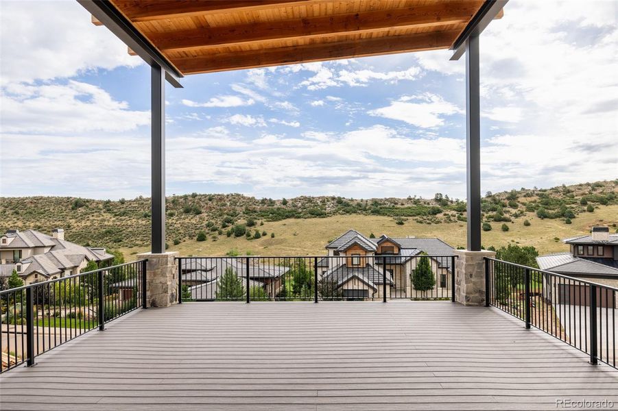 Perched high, the generous covered deck offers views and space for relaxing, dining and entertaining