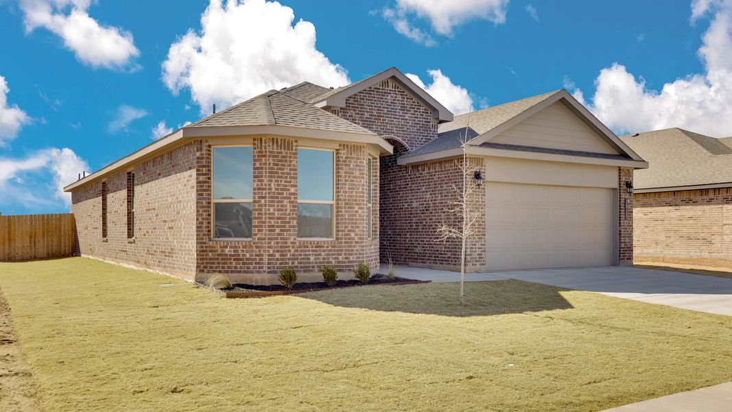 Front exterior of a new home in Viridian, Lubbock, TX, highlighting curb appeal (Image 14).