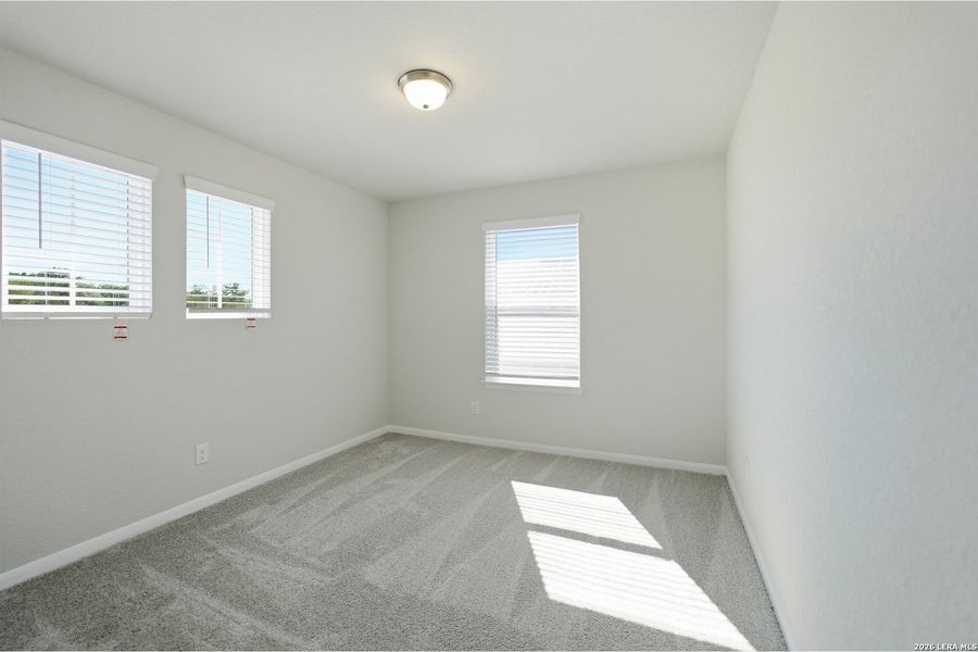 Spacious, unfurnished interior of a new home in The Woodlands at Medina Hills, Mico (Image 29).