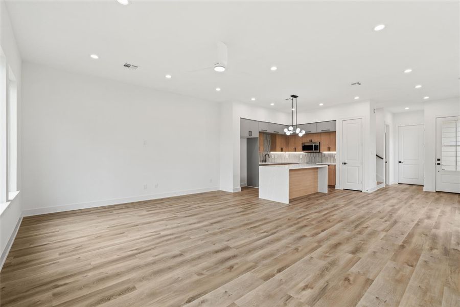 Wide living area with a seamless flow into the kitchen and dining space.