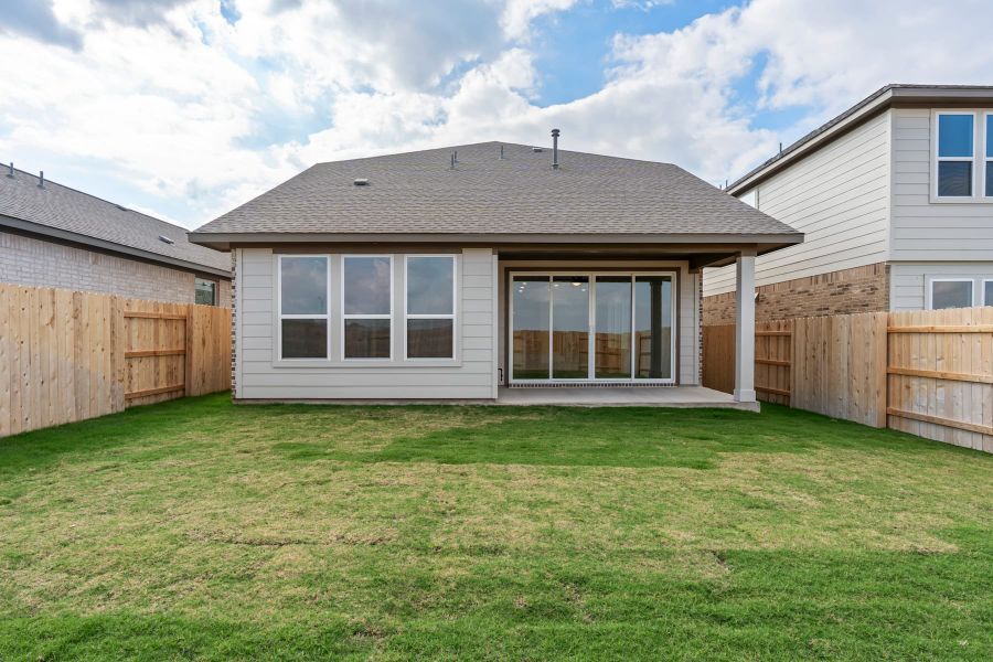 Exterior details and patio area of a home in Lariat, Liberty Hill (Image 28).
