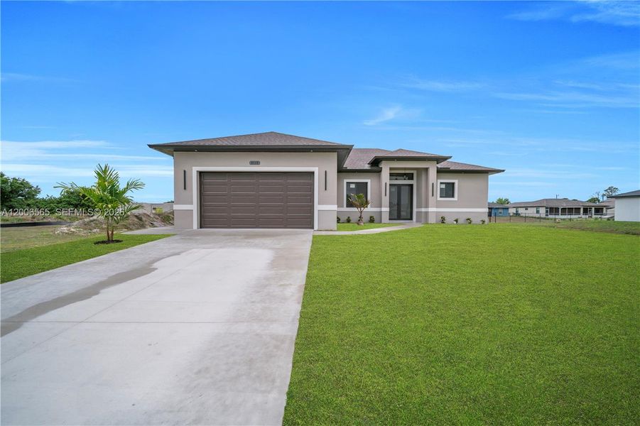 Front exterior of a new home in , Lehigh Acres, FL, highlighting curb appeal (Image 20).