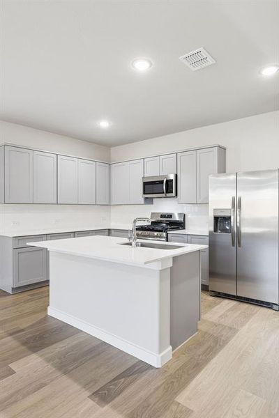 Kitchen in the Haylee home plan by Trophy Signature Homes - REPRESENTATIVE PHOTO Kitchen in the Haylee home plan by Trophy Signature Homes - REPRESENTATIVE PHOTO