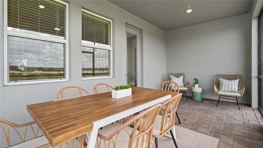 Dining area featuring brick floors and recessed lighting Dining area featuring brick floors and recessed lighting