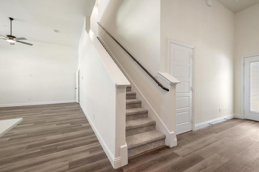 Door to Right of Stairs leads to Oversized Garage