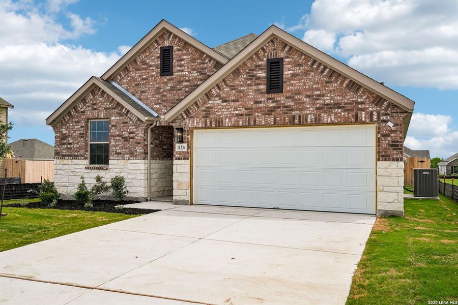 Front exterior of a new home in Prairie Green, Converse, TX, highlighting curb appeal (Image 16).