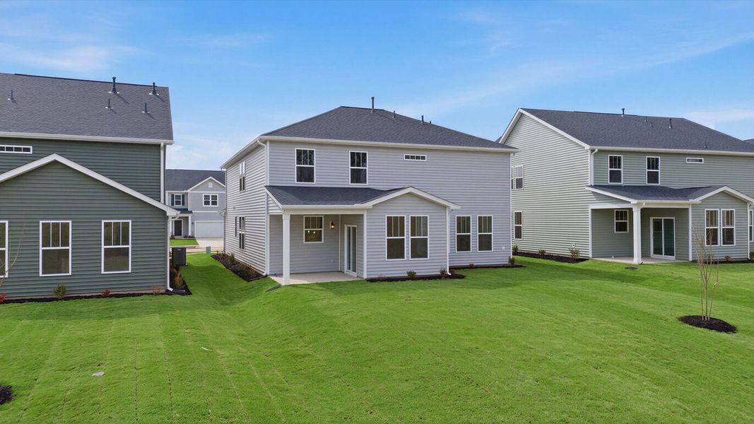 Exceptional outdoor living begins with a covered back porch in this thoughtfully designed home located in Gray Court, SC