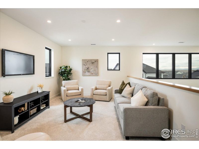 Not only does this amazing loft space overlook the gorgeous Great Room, but it's also filled with so much light from its own three windows
