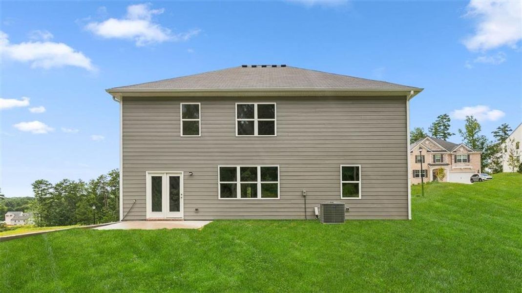 Exterior details and patio area of a home in Brooks Station, Dacula (Image 2).