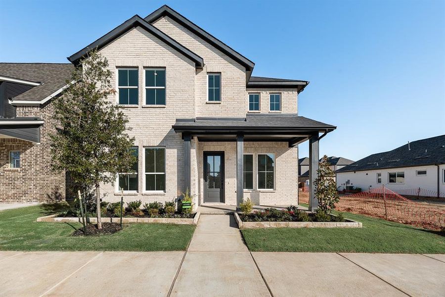 Front exterior of a new home in Cottages of Celina, Celina, TX, highlighting curb appeal (Image 24).