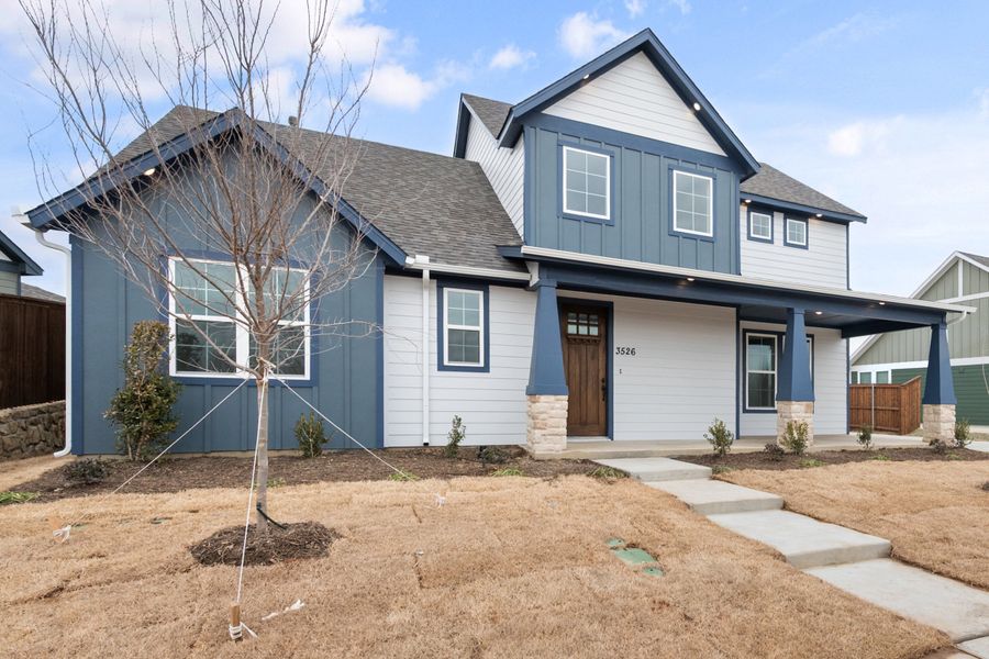 Front exterior of a new home in Heritage Towne, Midlothian, TX, highlighting curb appeal (Image 25). Front exterior of a new home in Heritage Towne, Midlothian, TX, highlighting curb appeal (Image 25).